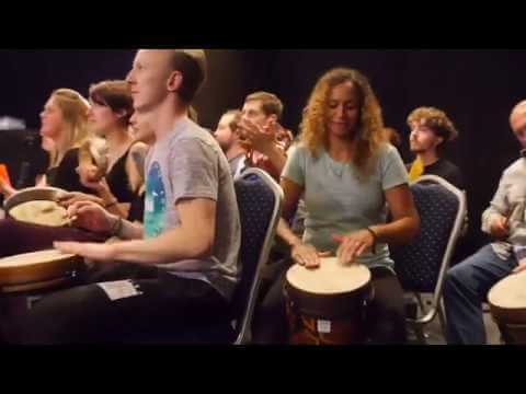 Robert Lawrence Friedman facilitates his "Drumming Celebration" program for the Halsa Group, a chiropractic organization in Windsor, England ...